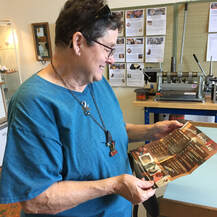 Kathe Dunn checking out new brochure
